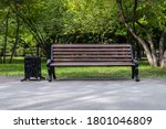 Wooden vintage bench in a public Park.