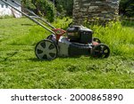 Old Reliable Lawn Mower On The...