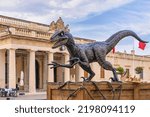 Small photo of Statue of Blue Velociraptor who starred in recent film, Jurassic World Dominion which was filmed partially on location in Malta, now placed on Valletta for tourist: Valletta, Malta - August 31, 2022