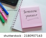 Small photo of Sticky note with the text Introduce yourself on office desk. Self-introduction concept.