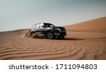 Small photo of Desert, Abu Dhabi / United Arab Emirates - 10/02/2019: Conquer Everywhere, Cruising around in the desert with this truck, suv, vehicle, jeep
