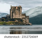 Small photo of Perched at a captivating viewpoint, the iconic Eilean Donan Castle reveals its enchanting splendor. Surrounded by shimmering waters and nestled amidst rugged landscapes