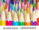 Small photo of BUNCH OF COLORED PENCILS OR CRAYONS. BACK TO SCHOOL AND PLAYGROUP. DRAWING, CRAFTS, CREATIVITY AND PLASTIC ARTS. CLOSE UP.