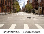 Small photo of New York, NY / USA - April 10, 2020: Normally busy streets in lower Manhattan are virtually deserted after New York City officials imposed a COVID-19 lockdown of stores, businesses and restaurants.