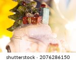 Abstract New Year 2022 background with toy retro car carrying presents, Christmas tree on roof selective soft focus. Winter shopping, sales concept. Happy winter holidays. Automobile delivering gifts.