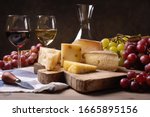 Wine  Cheeses And Grapes In A...