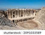 Small photo of Denizli, Turkey. Ruins of a large amphitheater in the ancient city of Hierapolis near Pamukkale.
