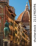 Small photo of Firenze, FirenzeItaly - August 2021: perspective of via dei Servi in Florence from piazza della Santissima Annunziata to the Duomo