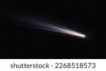 Small photo of Long tail of a comet glows in space. Shooting star. Real comet in the starry sky. The flight of a celestial body near the Earth.
