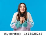 Small photo of Dreamy and upbeat, thoughtful young woman dreaming how she will spend all money cashback, placed cash deposit to save-up, holding credit card, imaging something lovely, smiling