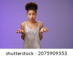 Small photo of Concerned frustrated and confused attractive african-american curly-haired girl cannot understant what happening raise hands clueless dismay look questioned silly asking what did wrong