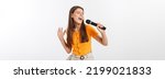 Small photo of Young pretty woman happy and motivated, singing a song with a microphone, presenting an event or having a party, enjoy the moment
