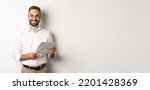 Small photo of Employer looking satisfied with work, reading documents and smiling pleased, standing over white background