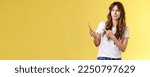 Small photo of Girl answers strange weird call receive crazy upsetting message cringe doubtful displeased smirking dismay pointing suspicious smartphone stand yellow background intense frustrated.