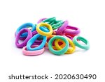 Heap of various hair ties. Multicolored elastics isolated on white background