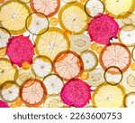Slices of lemon, orange, kiwi and backlit fruits. Macro 
