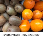 macro photo kiwi and persimon... | Shutterstock . vector #2076230239