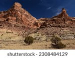 dramatic red rock formations   on a sunny winter day   in the san rafael river canyon along the buckhorn draw scenic byway in the northern san rafael swell near green river,  utah 