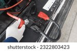 Small photo of The white powder that is on the head of the car battery is a fungus that appears due to an alternator overcharge which can cause overheating at the positive pole.