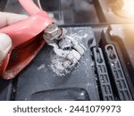 Small photo of Terminal battery broken,The white powder that is on the head of the car battery is a fungus that appears due to an alternator overcharge which can cause overheating at the positive pole.