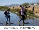 Small photo of Juarez, Mexico: Migrants, mainly from Venezuela, seek asylum before Title 42 ends at Mexico-US border (May 13, 2023). Seeking safety, hope, and a better future