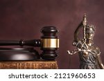 Small photo of Law and judgment concept. Figure of Lady Justice in notary office close-up.