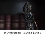 Small photo of Concept showing of Problems with legal system, delay or slow in judicial justice system by using judge hammer, and clock.