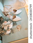 Small photo of ISTANBUL, TURKEY - MARCH 17, 2023: The LAB brand bridal shoes, Chloe brand women's perfume, wedding rings, and bridal bouquet are displayed decoratively.