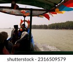 Small photo of fisherman boat at beach in Indonesia, June 13, 2023, pengunjung wisata pantai widuri pemalang, sedang naik perahu nelayan dengan biaya 20 ride a fishing boat, as a tourist destination selama 15 menit