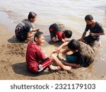 Small photo of The people at beach. Indonesia, June 22, 2023, anak anak dan pengnjung, wisatawan berlibur dan bermain ombak pasir air pantai widuri, pantai ombak kecil, pantai utara pula jawa, ombak tenang landai