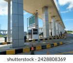 Small photo of Yia airport exit, Indonesia February 21, 2024 YIA airport exit gate, you can see tall pillars and the exit lane for vehicles, with an electronic money card system, is unguarded