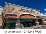 Small photo of 2024 March 19: Santa Clarita, CA. Jo-Ann, JoAnn Fabric and Crafts Store. Store front, blue sky. Angle view from left side entrance.