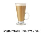 Latte macchiato in beautiful cup on an isolated white background with natural shadow. Cappuccino foamy coffee and milk drink in a transparent glass cup. Chai Latte pouring shot. Chai Latte Drink.