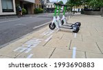 Small photo of London, United Kingdom - June 19th 2020: Electric scooter rental trial. Scooters for hire in Ealing, London. Trial period using Lime scooters in London.