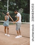 Two Tennis Players Talking On A ...