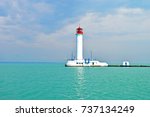 White Lighthouse In The Sea