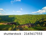 Small photo of Green mountains and daytime sky,Sky blue or azure sky and cloud overcast on mountain or hill is beautiful on daytime. Green tree forest or woods on mountain view beauty. Tourist travel to refresh