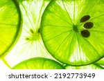 Small photo of Macro lemon background,Macro Lime,Lemon and green lime overlapped slices close-up background,Macro lemon texture