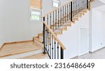 Small photo of Bright and airy maple colored stairs