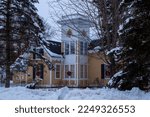 Small photo of Taylors Falls, Minnesota USA January 12, 2023 Historic 1858 Samuel B. Dresser-1893 tower addition-Dr. Horace G. Murdock house decorated with Christmas wreaths on a winter day in Taylors Falls, MN USA.