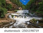 Beautiful Willow River Falls on a cool, August summer day in Willow River State Park in Hudson, Wisconsin USA.