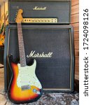 Small photo of Bangkok, Thailand - May 7, 2020 : fender stratocaster sunburst original 1962 The legendary guitar that Many guitarists choose to use and Marshall JMP Super lead 1978 on a store.