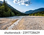 Small photo of Beautiful mountain stream river bed, passing its way through the mountain terrain and forest area of slovenian Alps, under the Triglav mountain