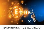 Small photo of The scientist's hand points to the equation of relativity of Albert Einstein. E equals m multiplied by c squared. In the concept of a physics equation ring and a dark blue background.