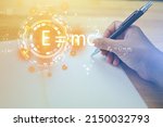 Small photo of Hands are writing a notebook with a pen and Albert's einstein general relativity equation. physics equations floated in light and graphics. the equation is emc2 or em c square student.