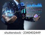Small photo of Businessman analyze business investment data from around the world using AI to help gather and summarize data into graph and chart in various form to be easy understand such as line, bar, pie charts