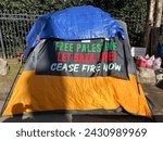 Small photo of Arlington, VA, USA - 02-22-2024: “Free Palestine, let Gaza live, cease fire now” sign on a tent set by pro Palestinians activists in front of the house of Antony Blinken, the US Secretary of State.