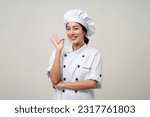 Young beautiful asian woman chef in uniform posting okay taste delight delicious hand gesture on isolated background. Cooking woman Occupation chef or baker People in kitchen restaurant and hotel.