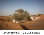 Small photo of AL MADAM, UNITED ARAB EMIRATES - MAY 28, 2022: the abandoned village of Al Madam is being gradually reclaimed by the desert. Desertification is one of the main ecological problems in the Gulf region.