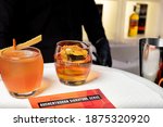 Small photo of Kiyv, Ukraine, November 22, 2020. «Old Fashioned» and «Unholy Alliance» Cocktails prepared on the basis of single malt Auchentoshan Scotch Whiskey at the bar. Scotch whiskey cocktails.